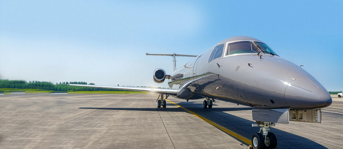 A photo of an ERJ3 plane on a runway.
